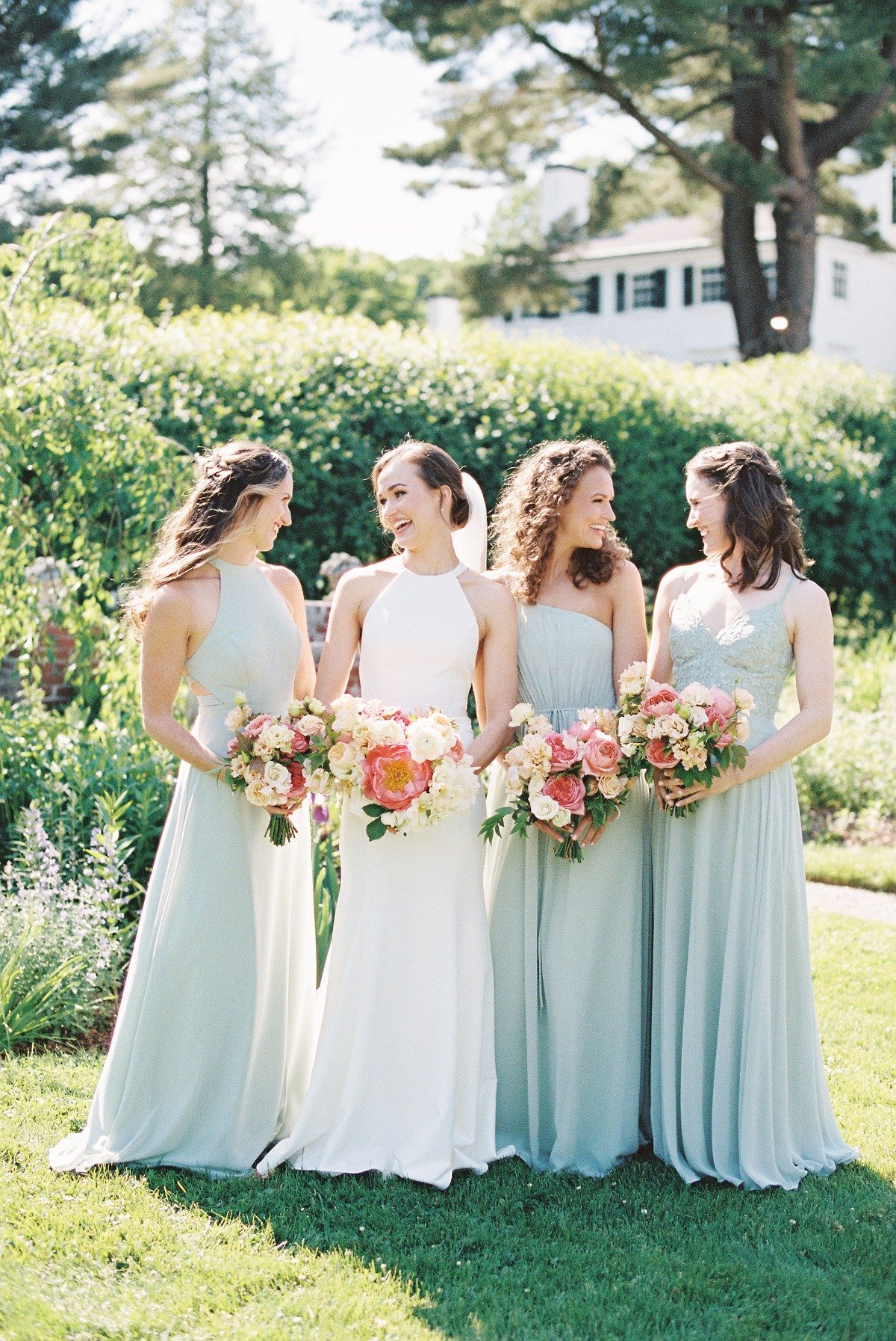 bride with her bridesmaids in mix and match mint dresses