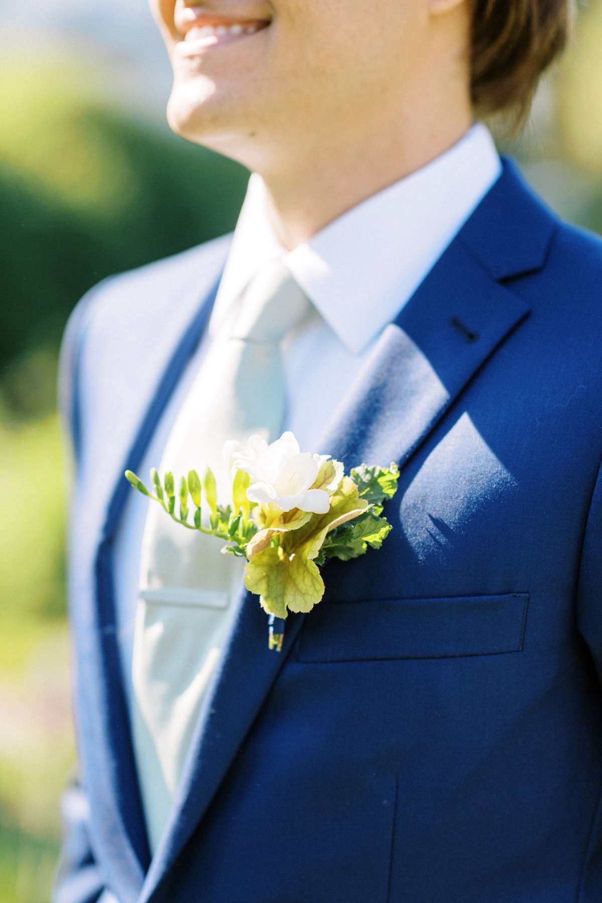 groom in blue suit