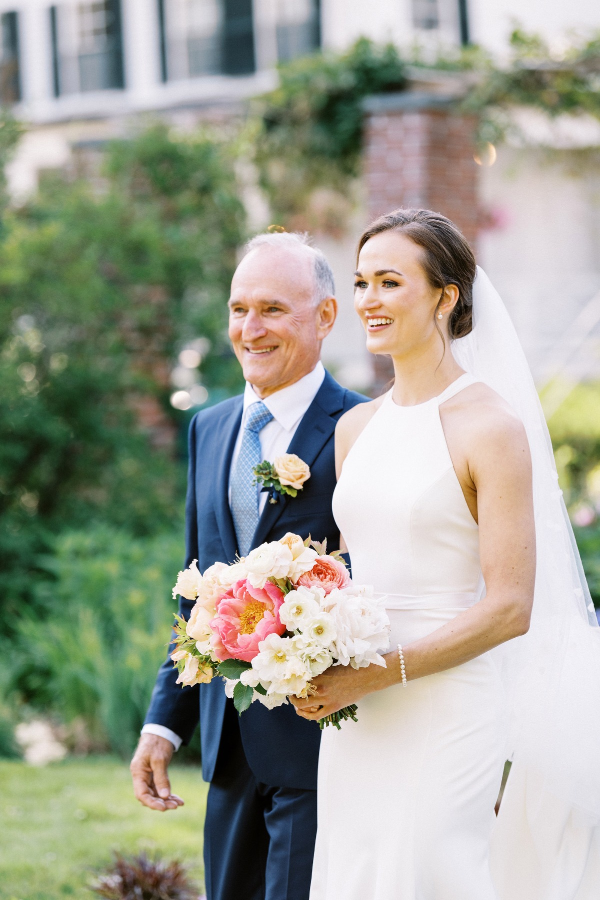 father walks bride down the aisle at garden wedding