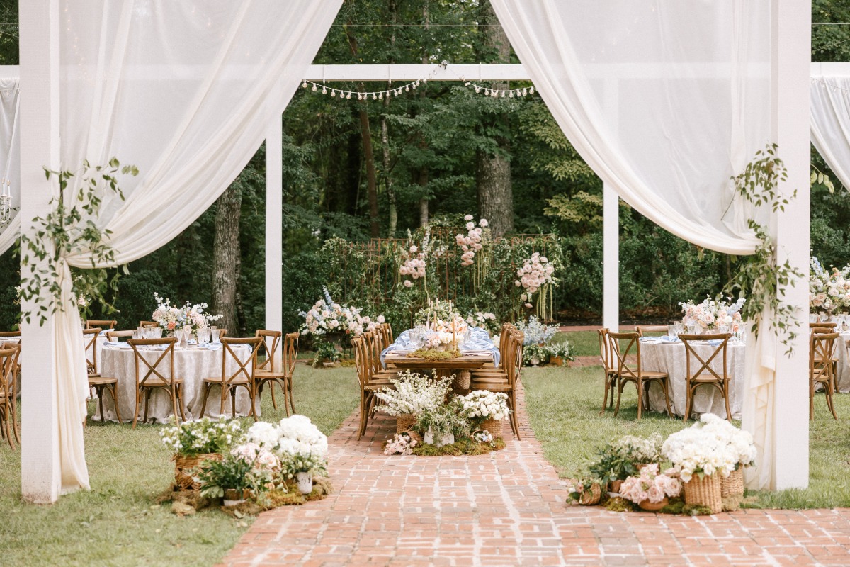 outdoor garden wedding reception with drapes