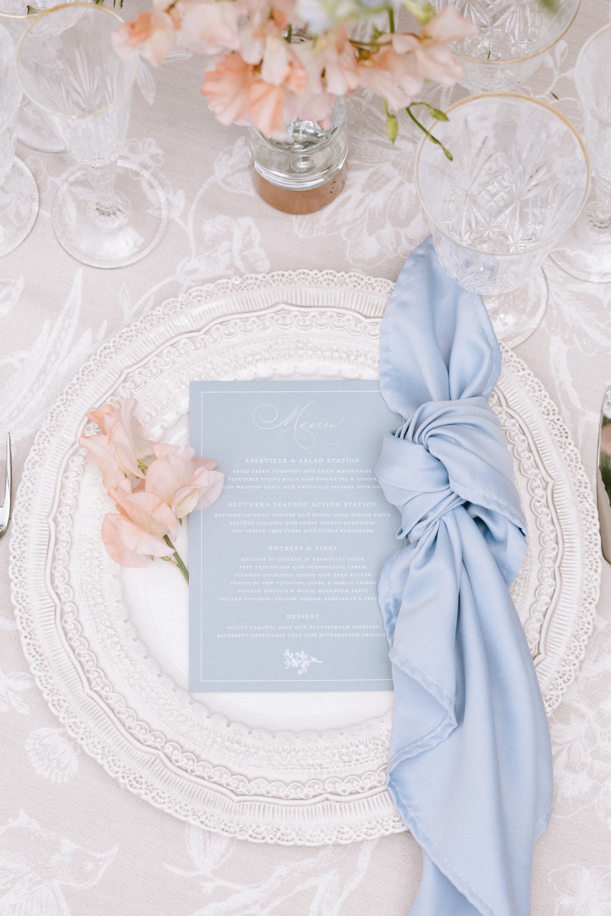 blue peach and champagne wedding tablescape with menus