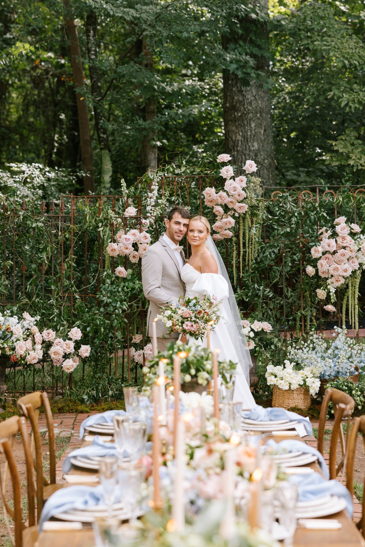 bride and groom at outdoor pastel wedding reception