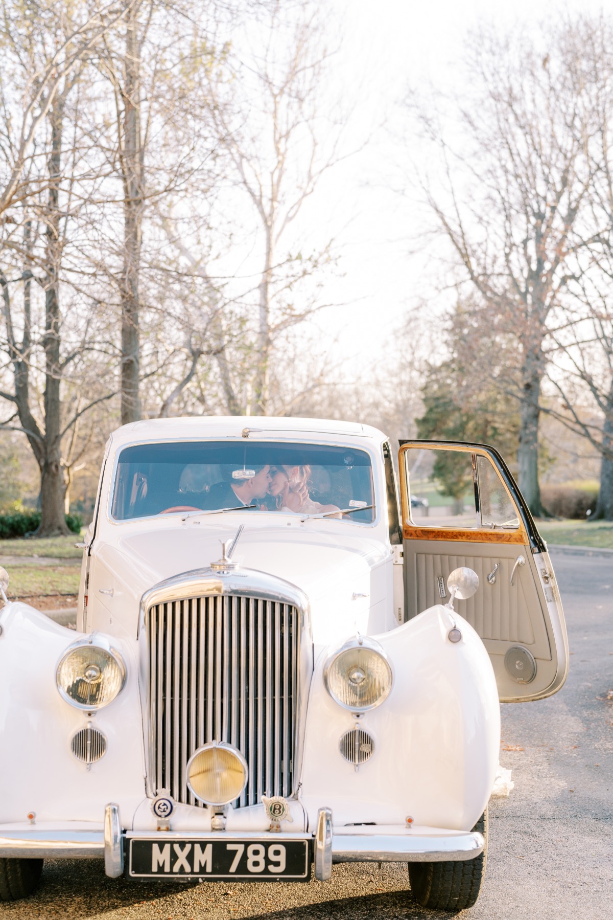 Bride and groom's vintage inspired grand exit with classic car