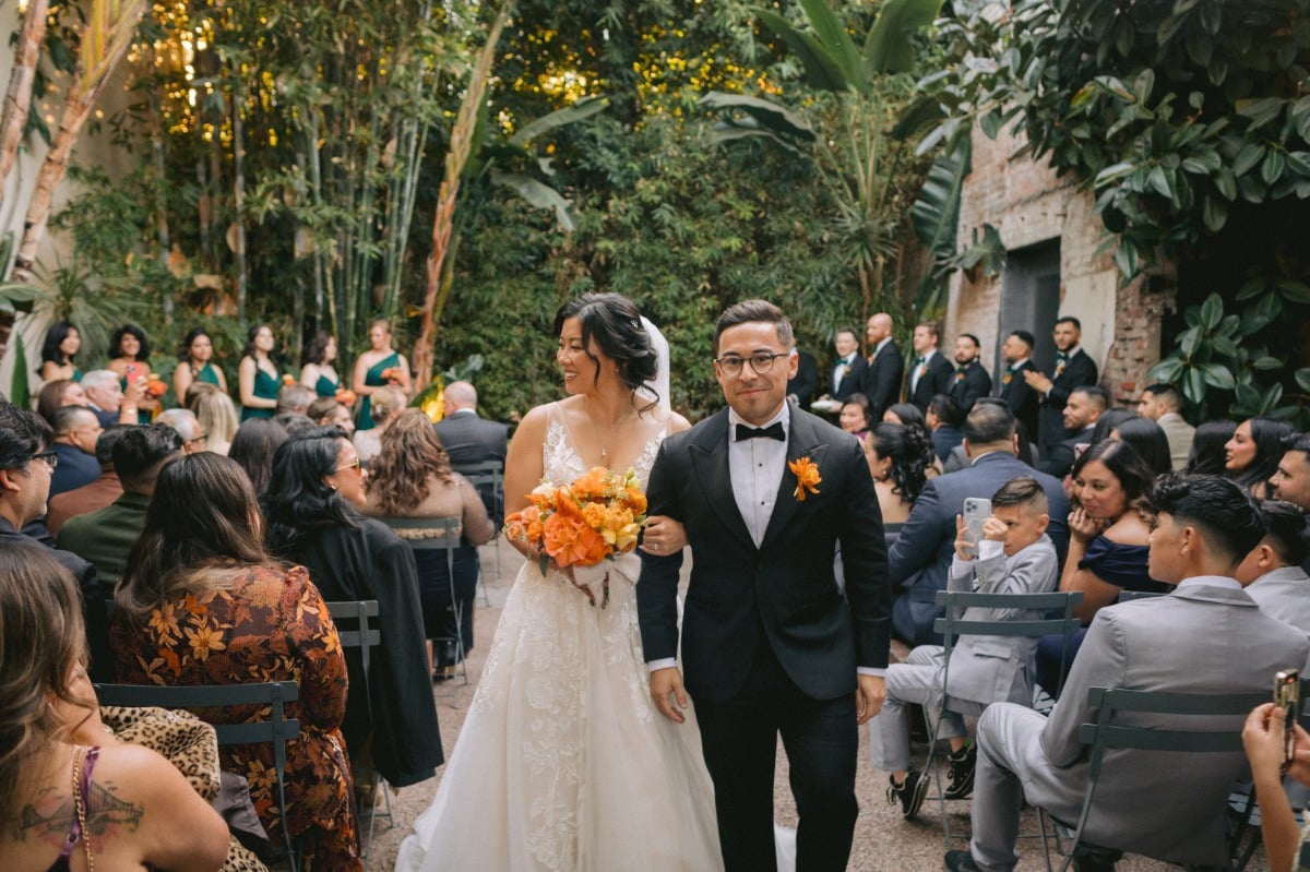 bride and groom at orange wedding ceremony in LA