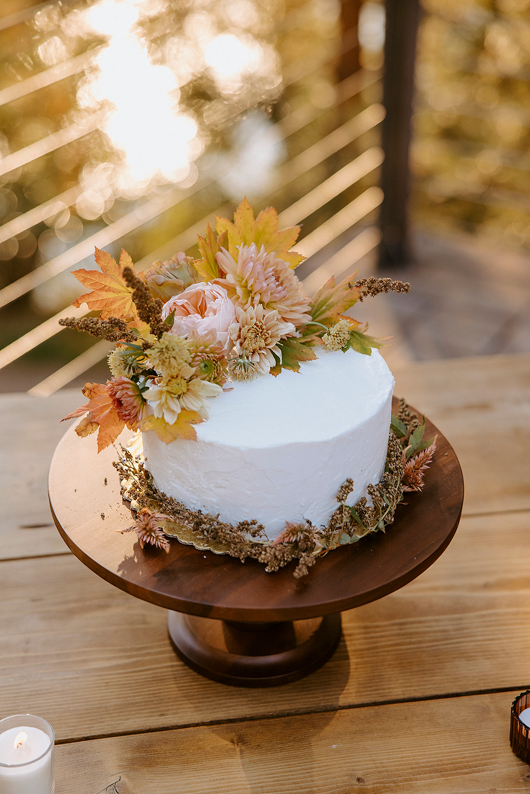 rustic simple wedding cake with fresh flowers