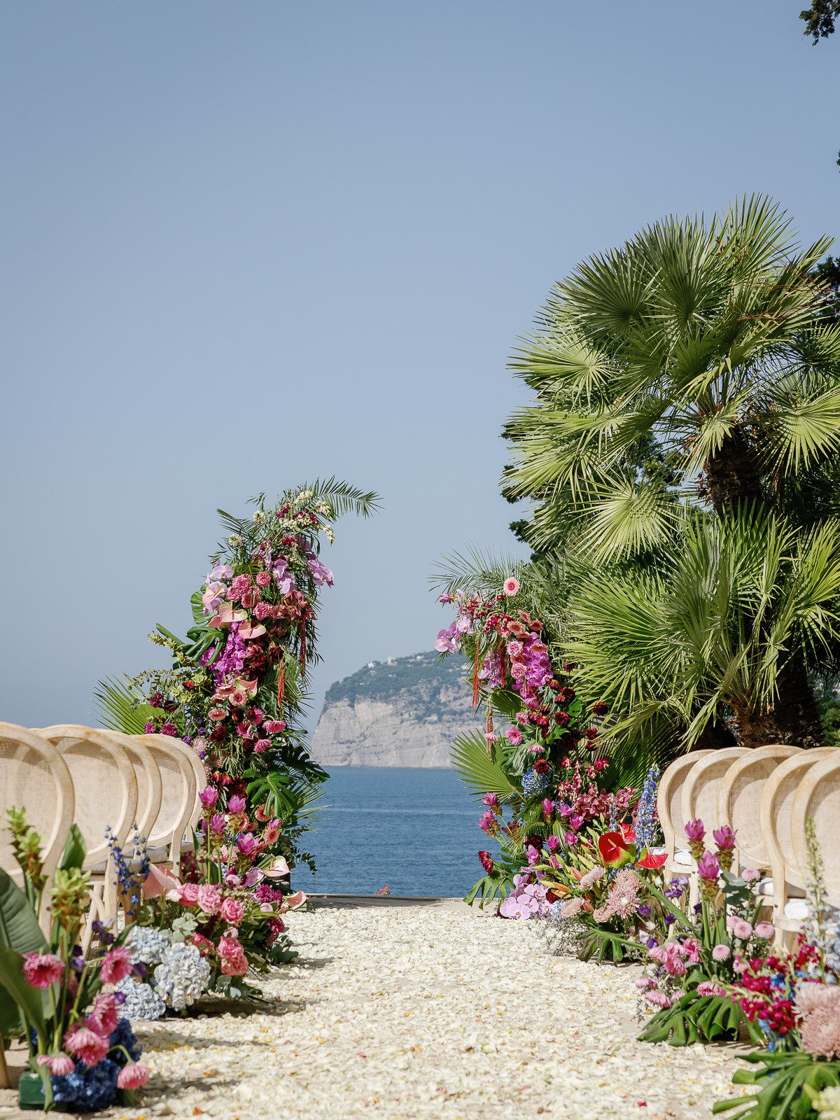 pink and purple tropical wedding ceremony flowers