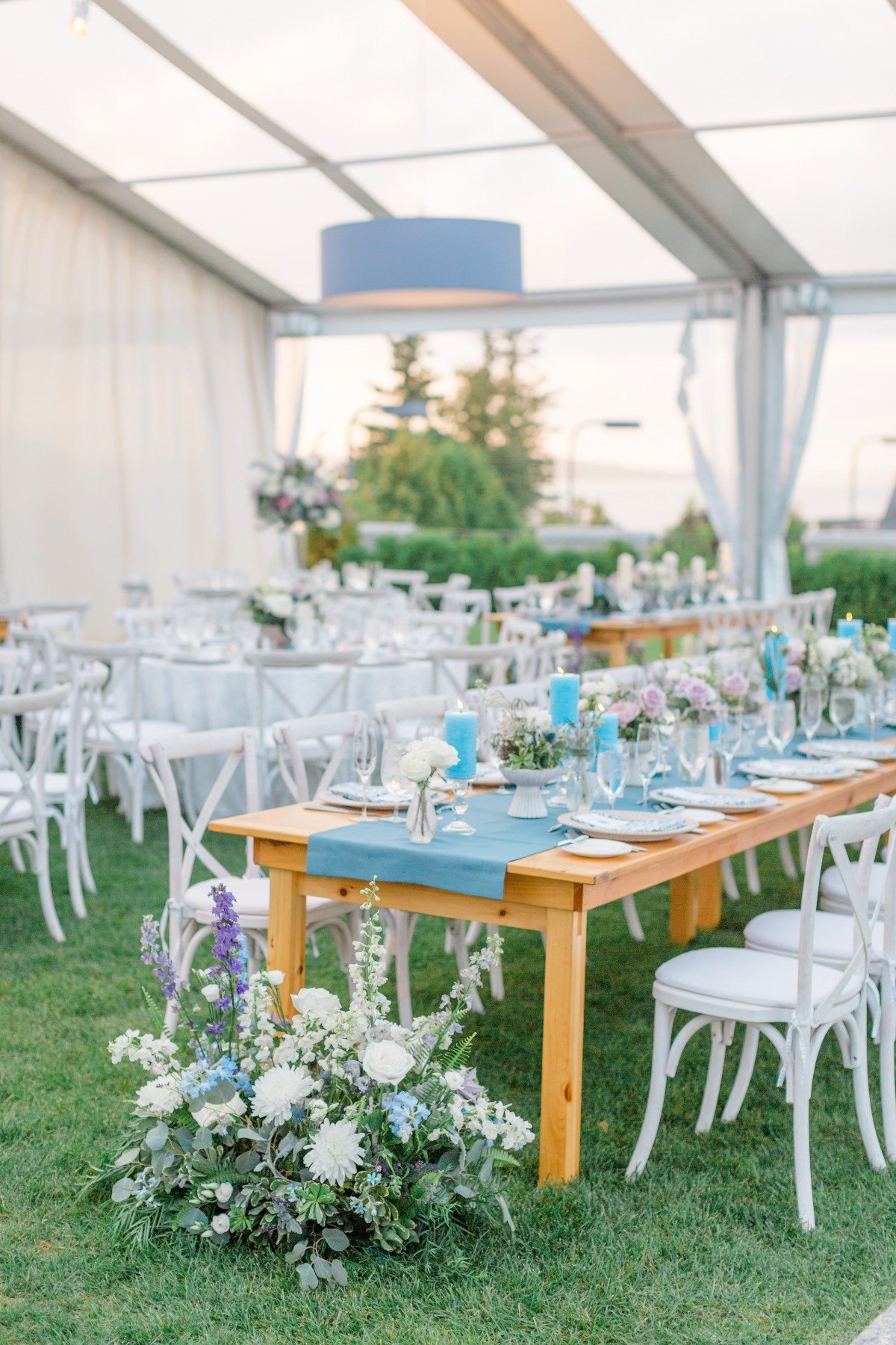 blue purple and white tented wedding reception