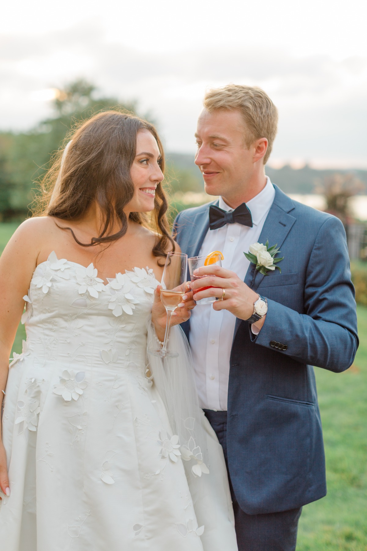 bride in oscar de la renta gown with 3d flowers