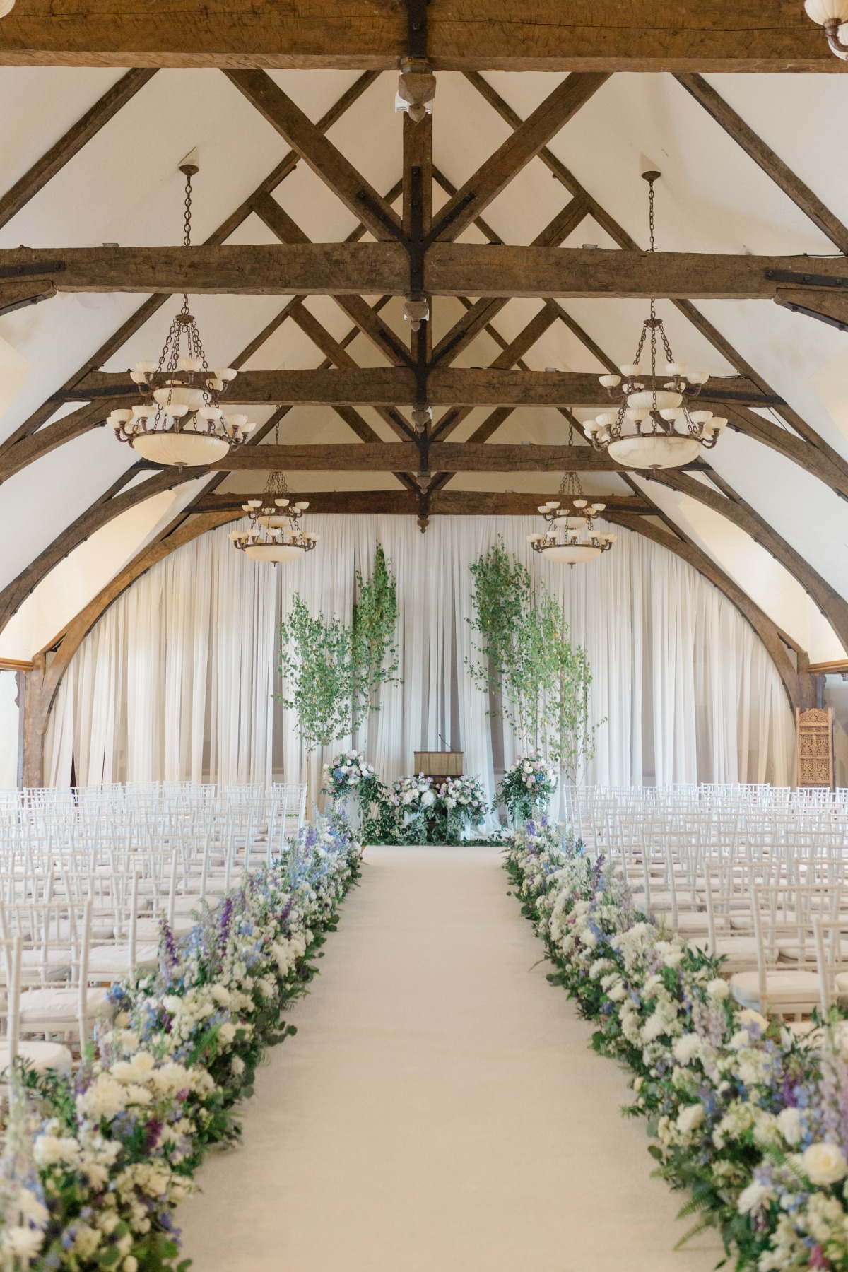 flower-filled chapel wedding in blue lavender and white