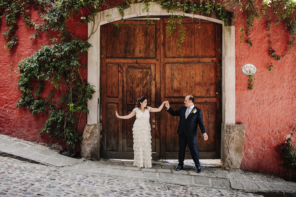 bride and groom dancing in mexican street