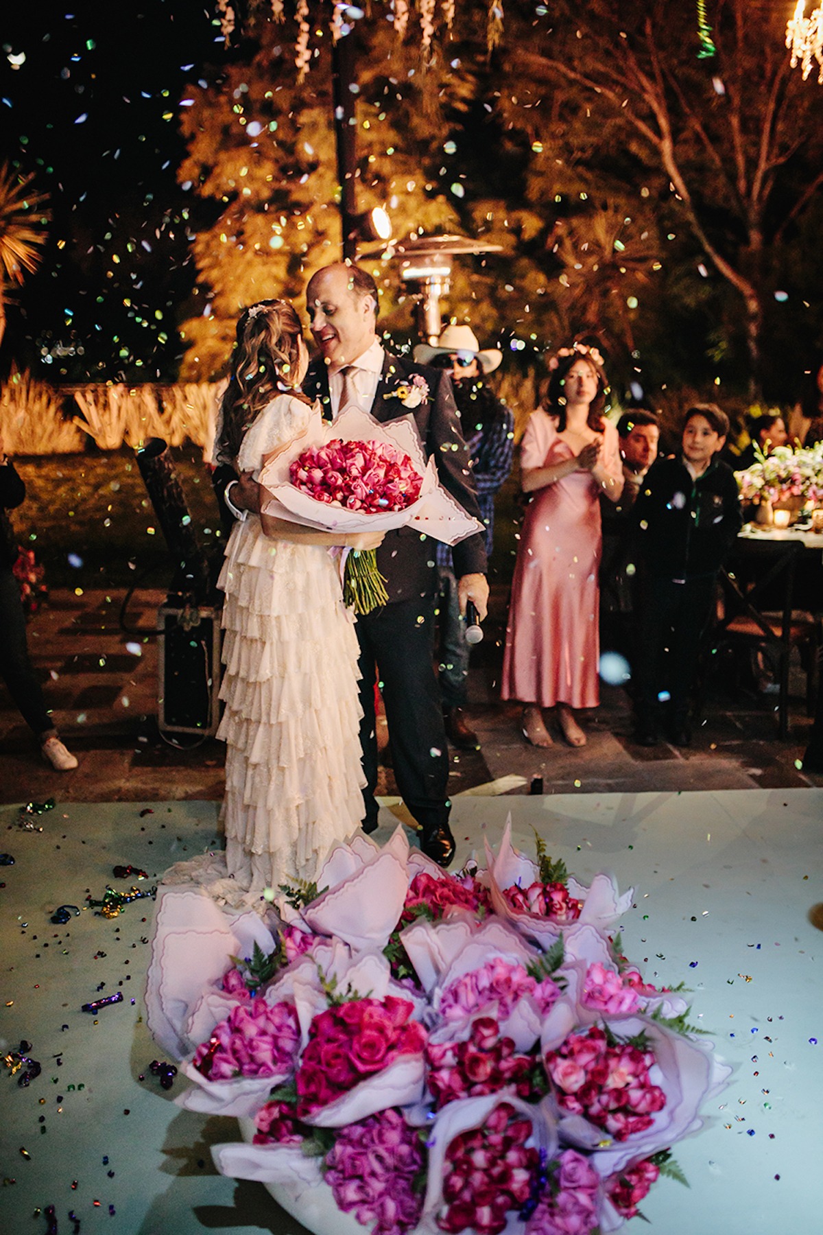 bride and groom get a flower petal shower at reception