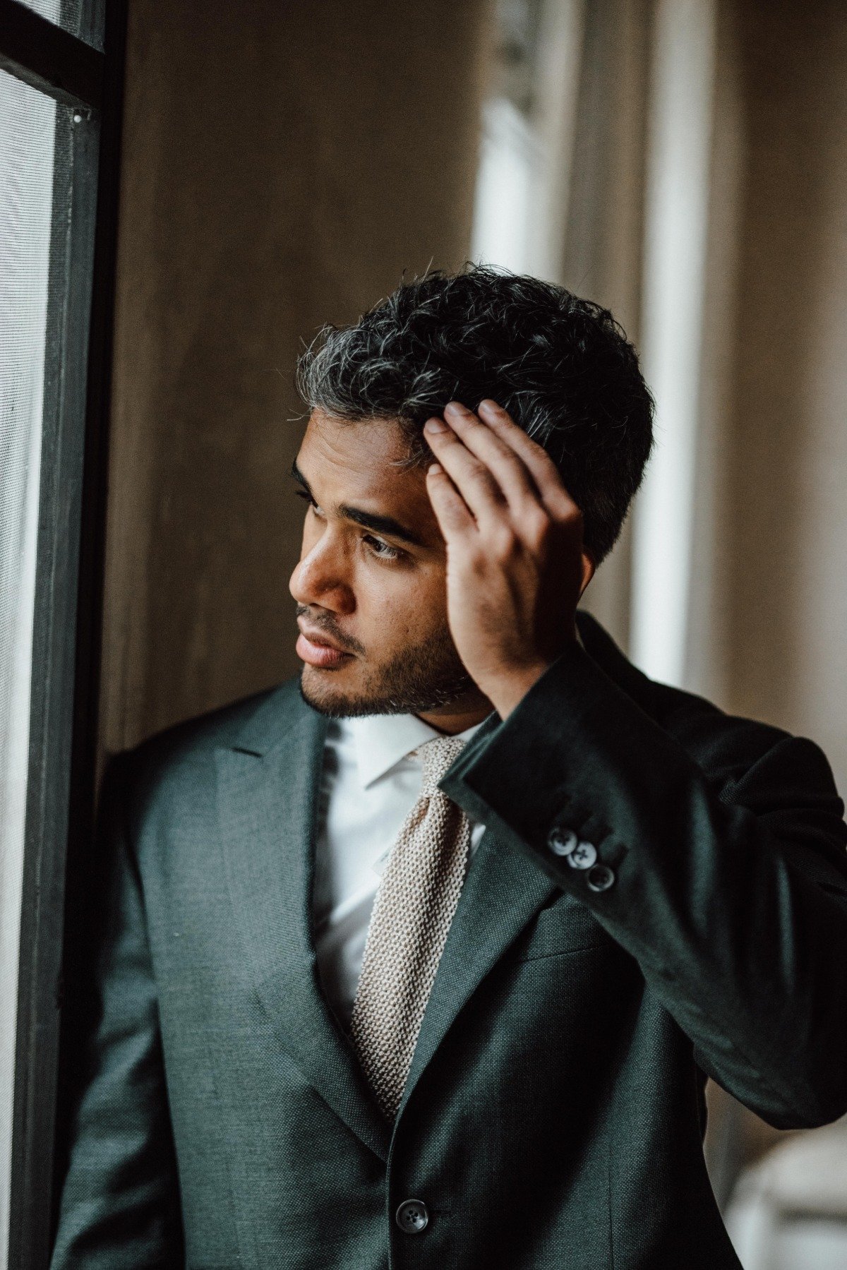 Tulum groom in custom made green suit 