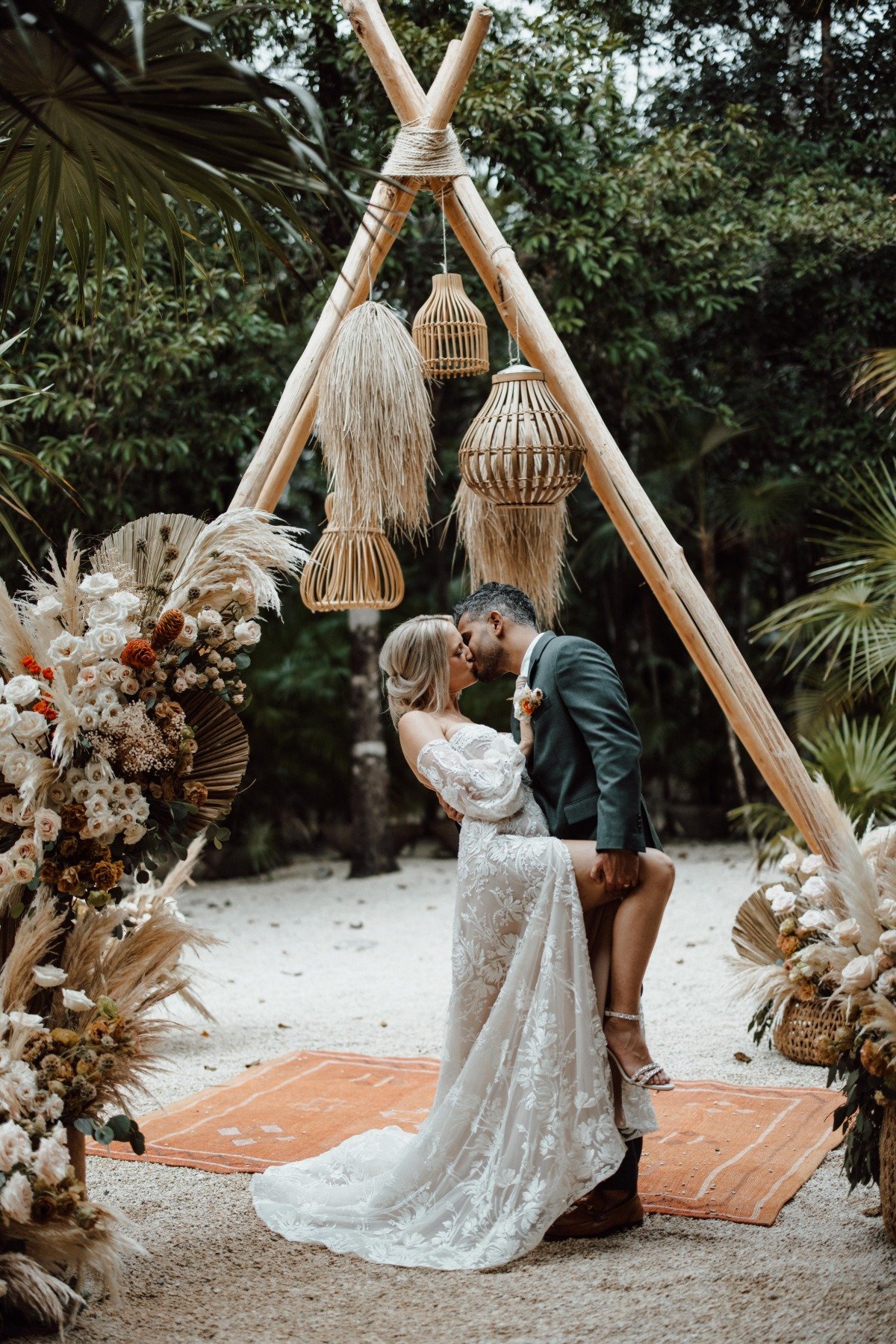 Romantic first kiss at Tulum jungle wedding ceremony