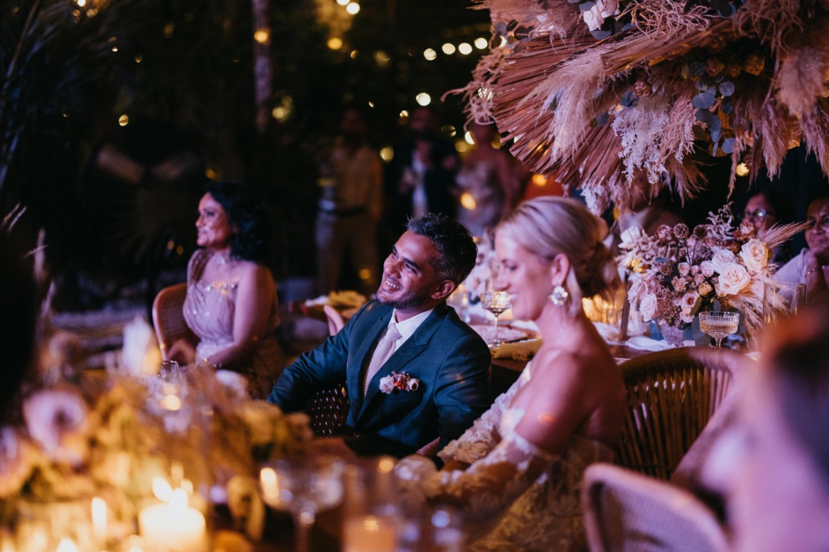 Tulum bride and groom enjoying reception dancing