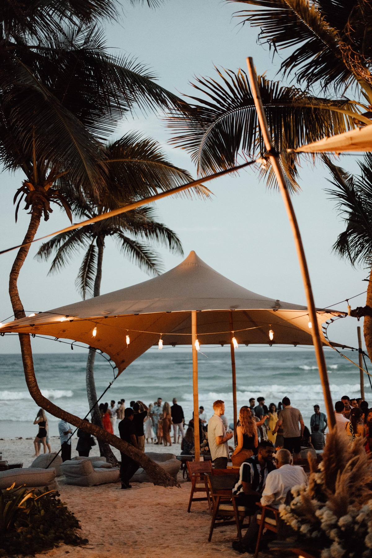 Wedding guests at dreamy beach reception 