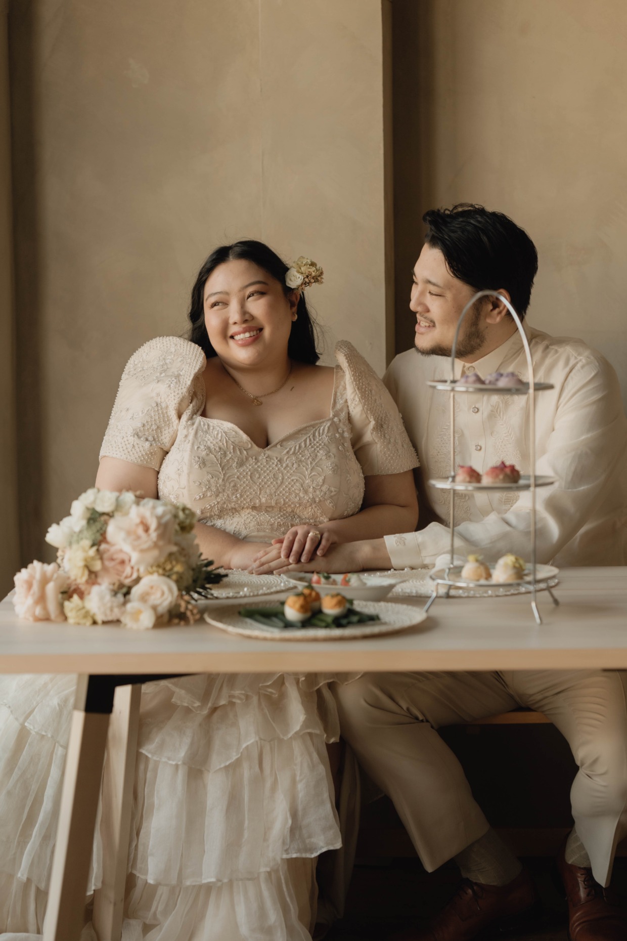 beautiful couple in custom wedding attire by Silviyana & Community