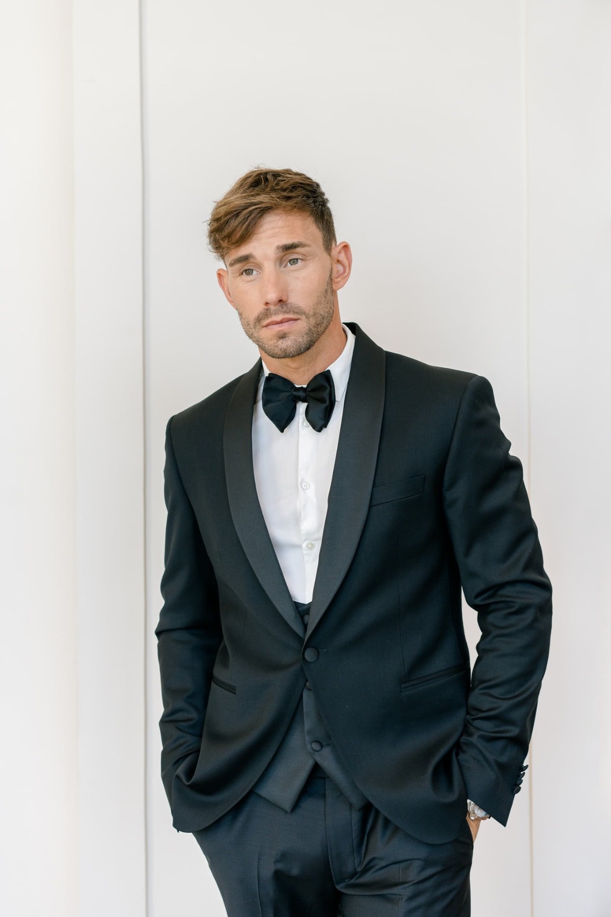 groom in black tuxedo at estate wedding