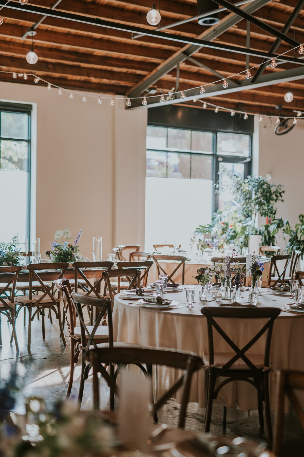 neutral linen and rustic wood reception design