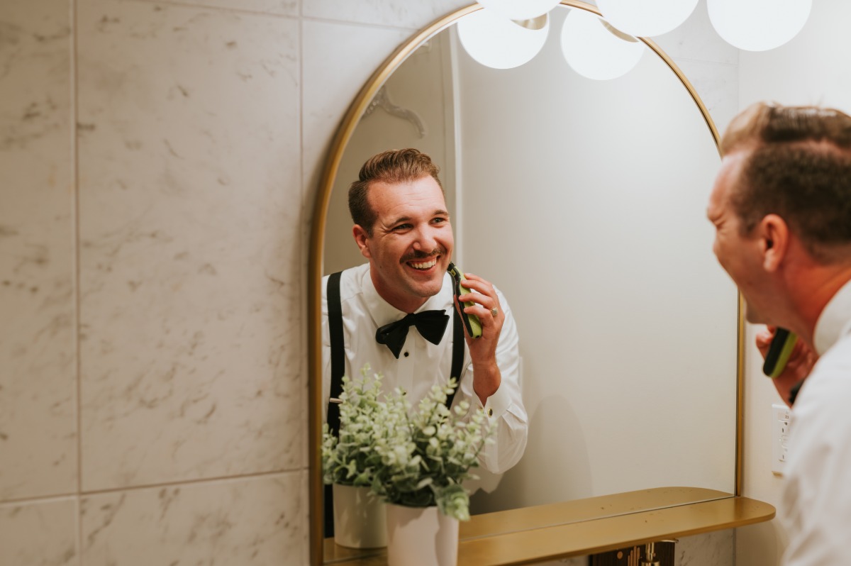 groom shaves beard into mustache before reception