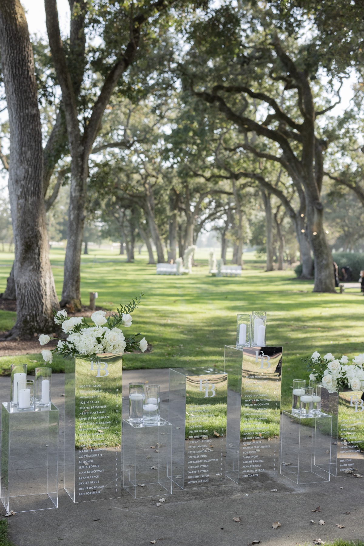 mirrored escort display ideas for wedding with white flowers