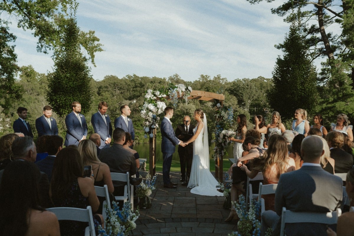 sunny garden wedding ceremony with blue colors