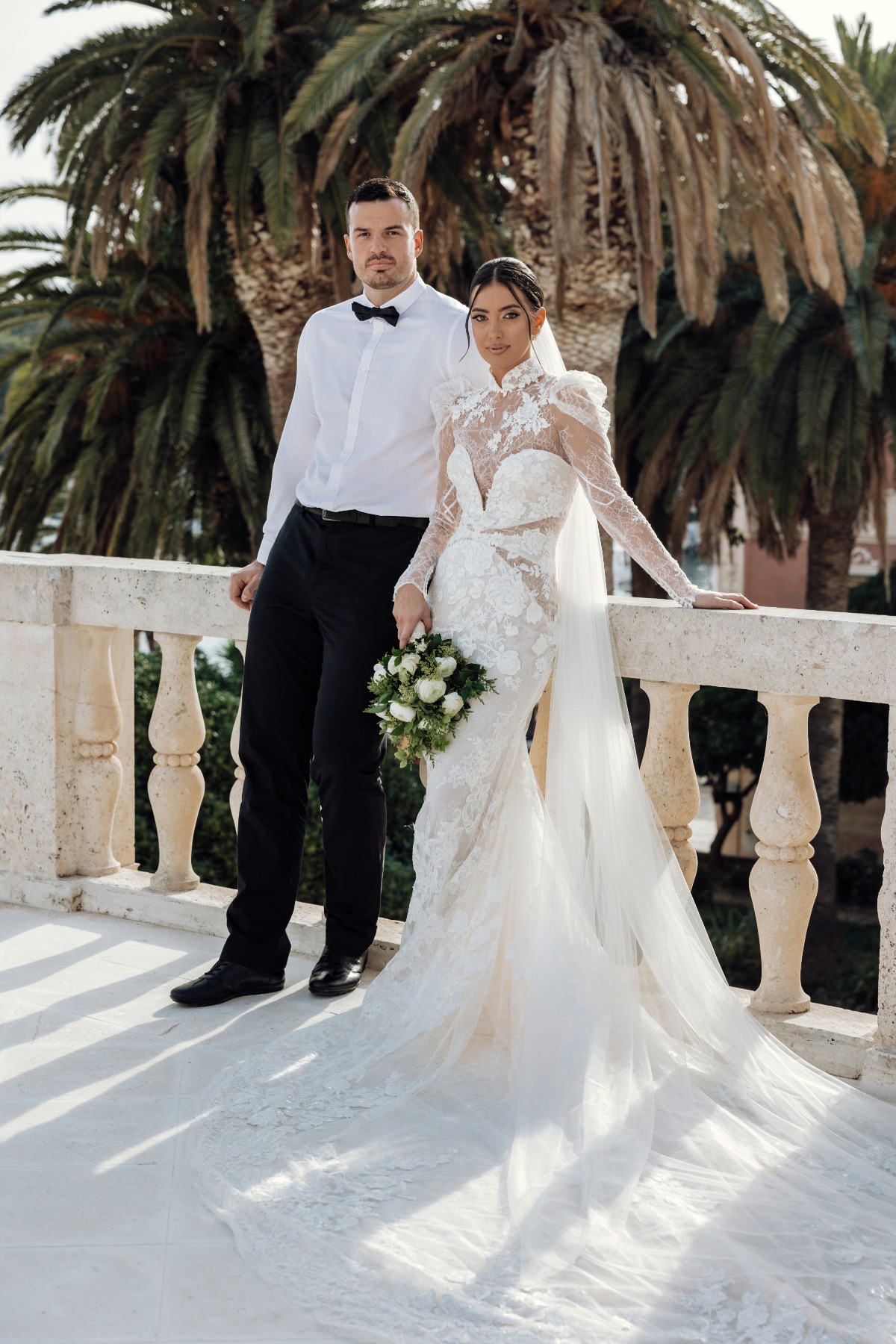 bride and groom on balcony in croatia