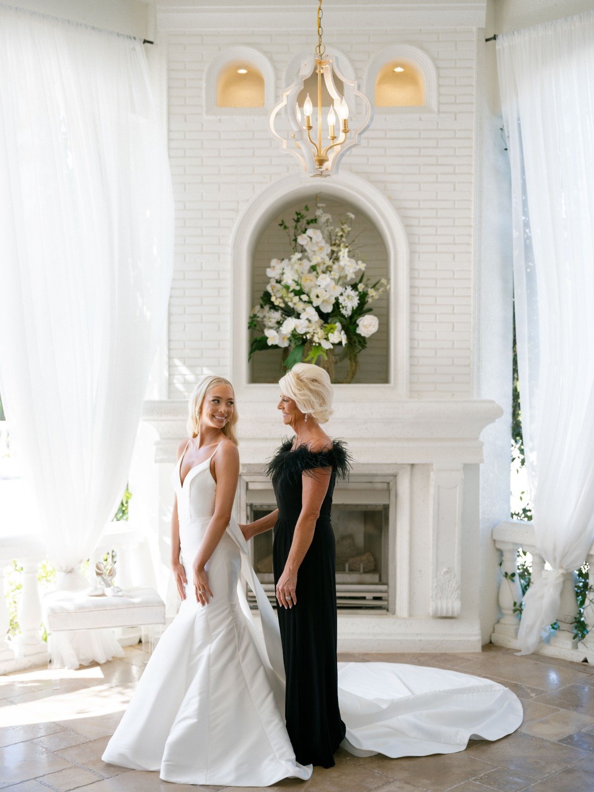 black feather-trimmed mother of the bride dress