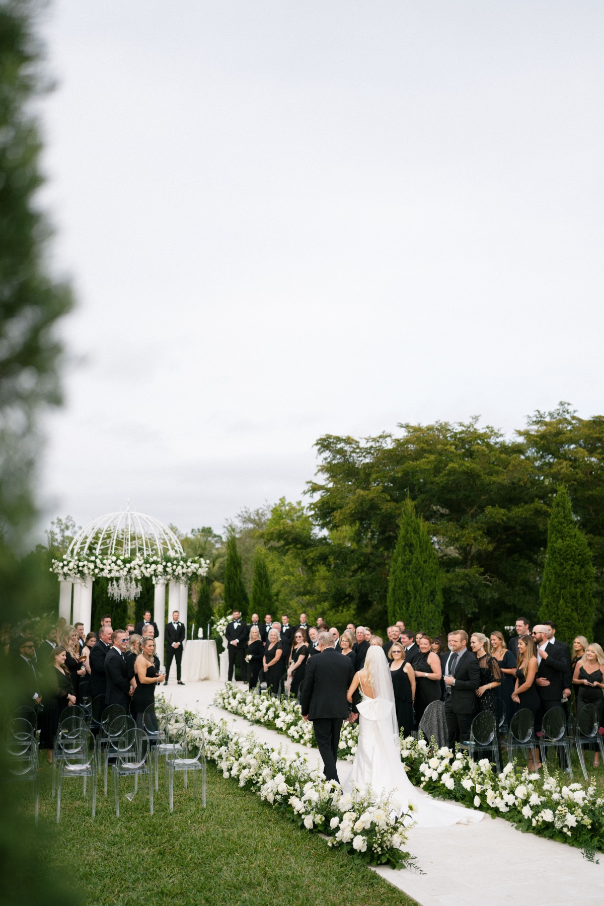 white rose and baby's breath wedding aisle