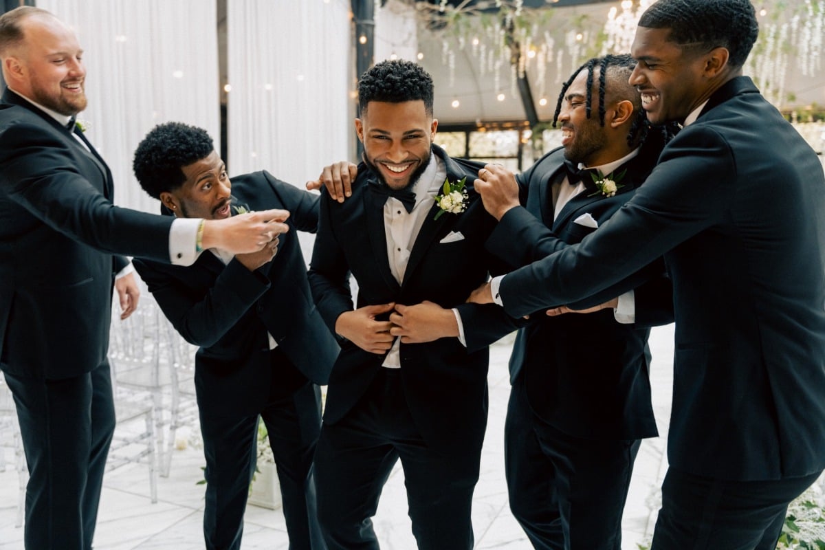 classic black suits with black bowties