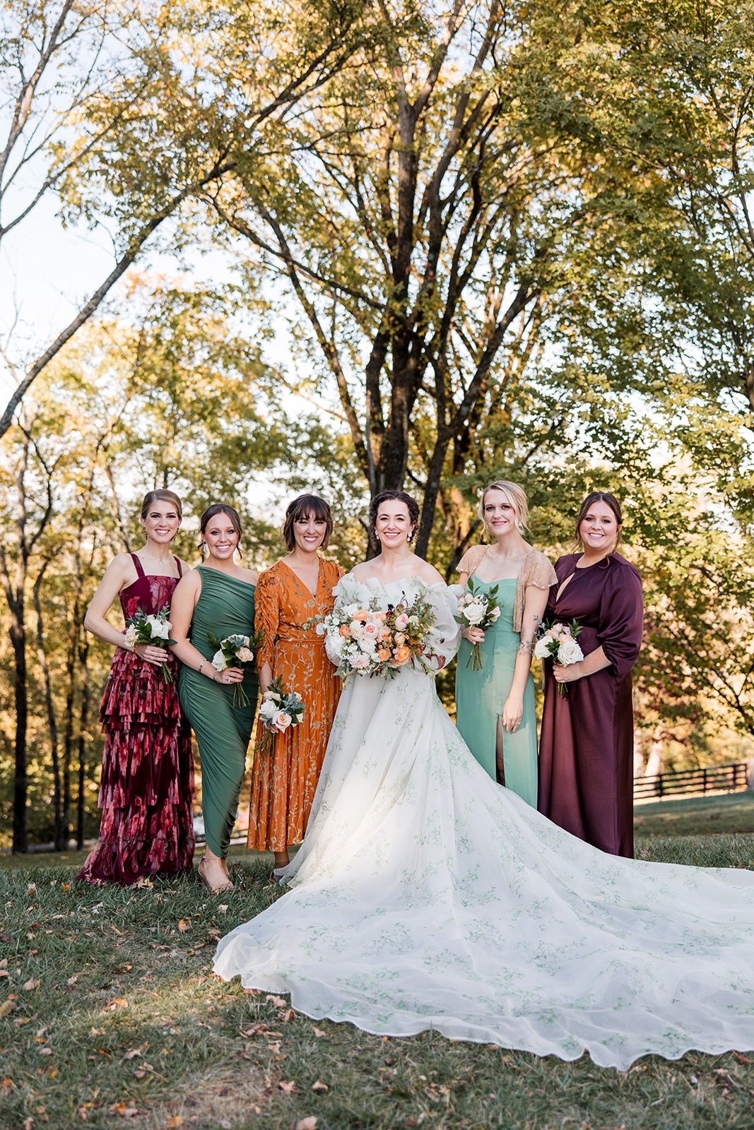 bride and bridesmaids in mix and match fall colors
