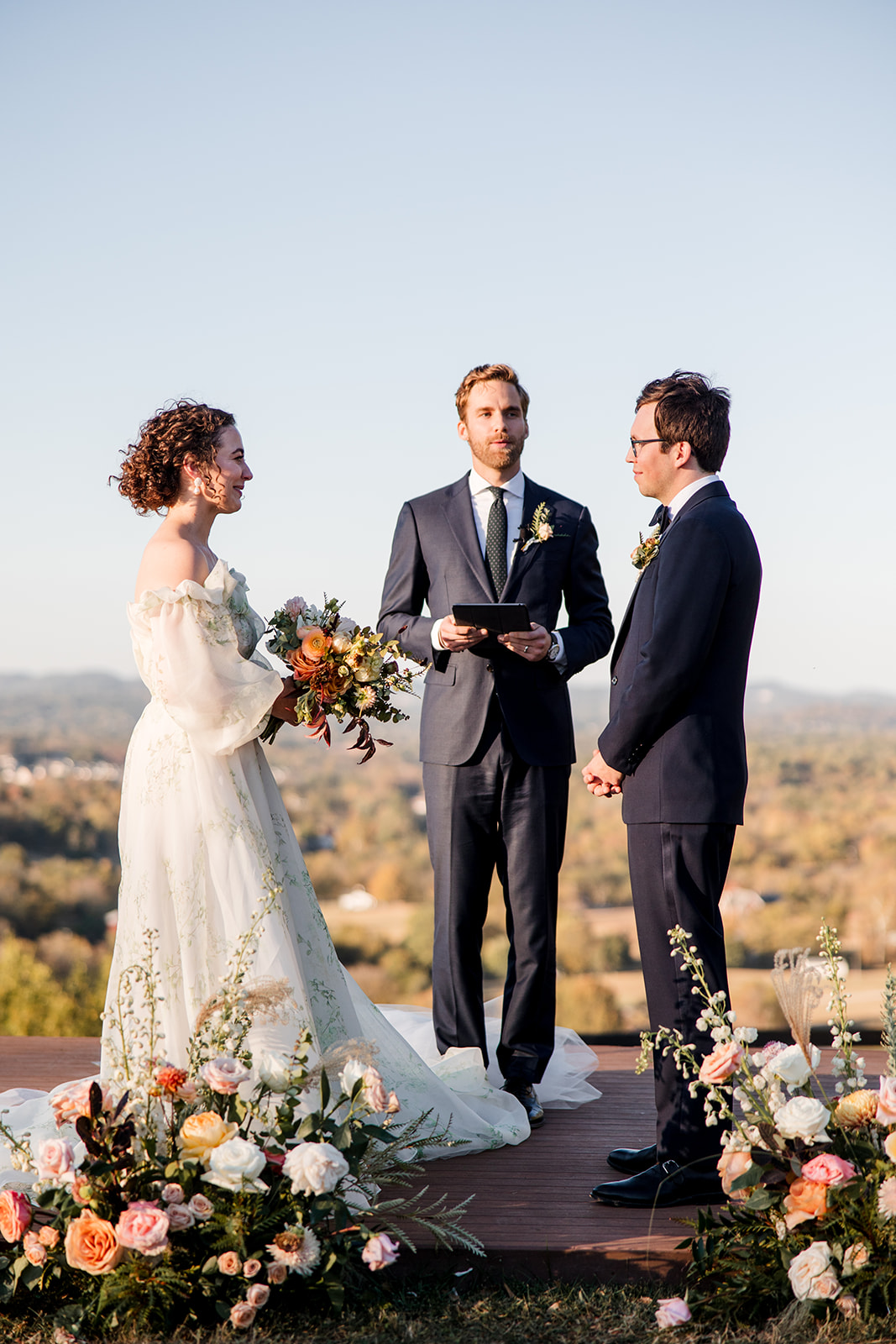 bride and groom at outdoor wedding ceremony exchanging vows 