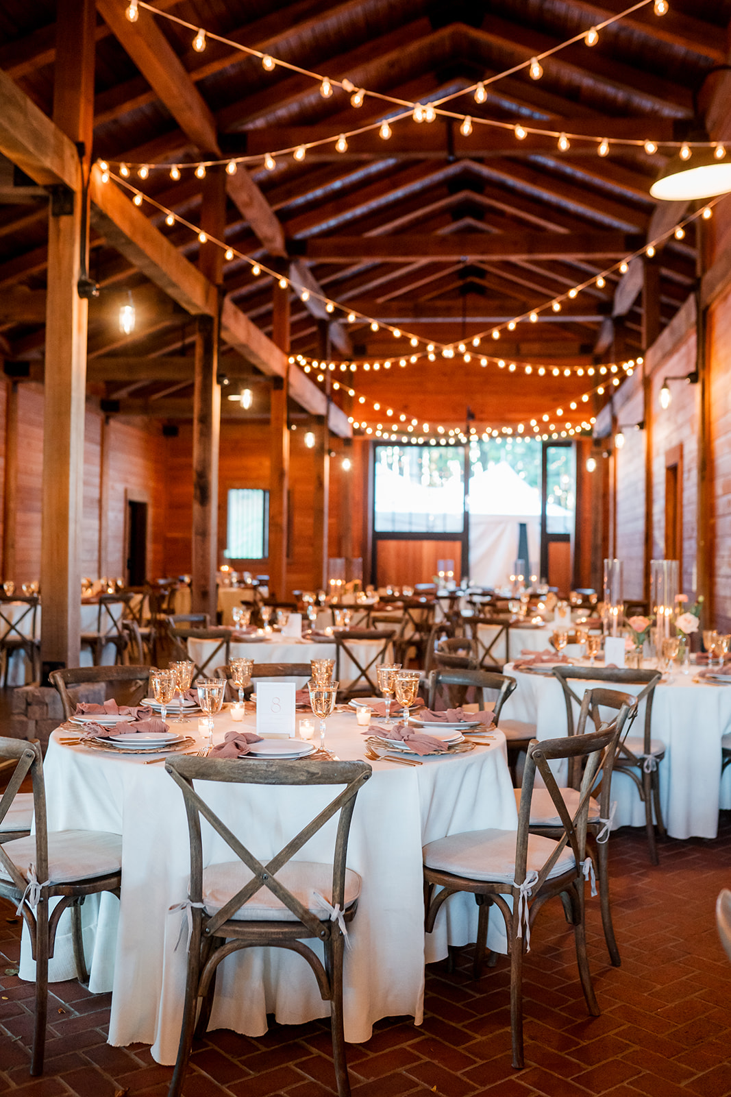 wood barn wedding venue in tennessee with twinkle lights