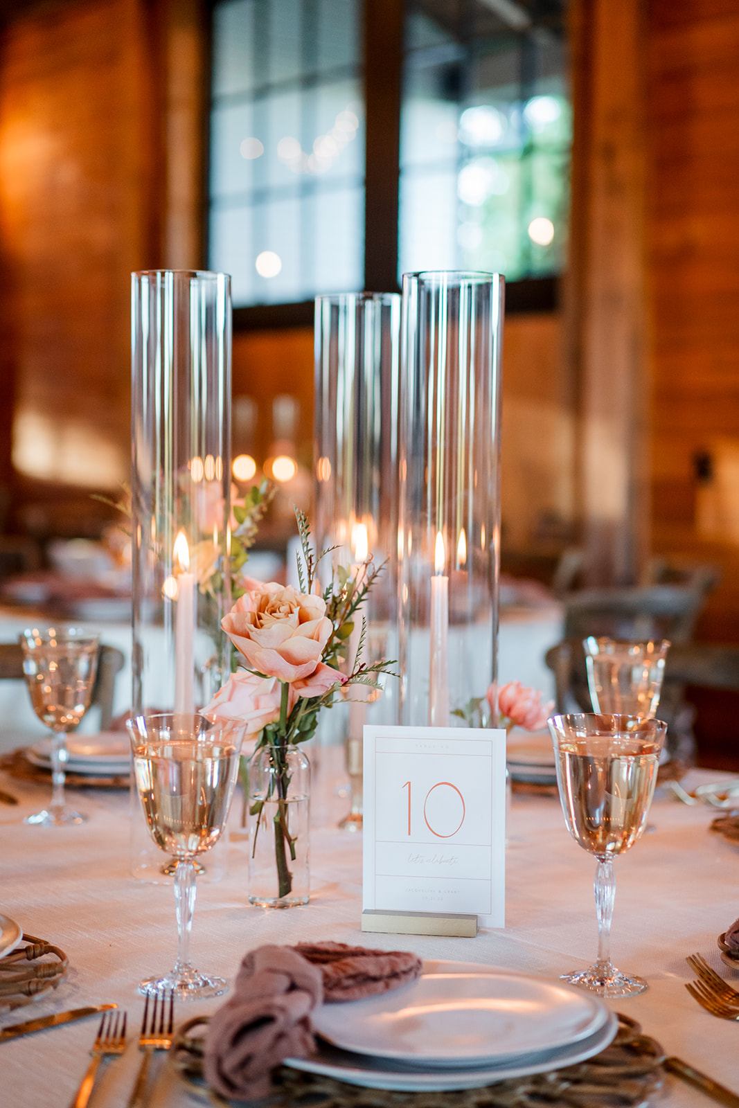 glass wedding decor with candles and peach roses