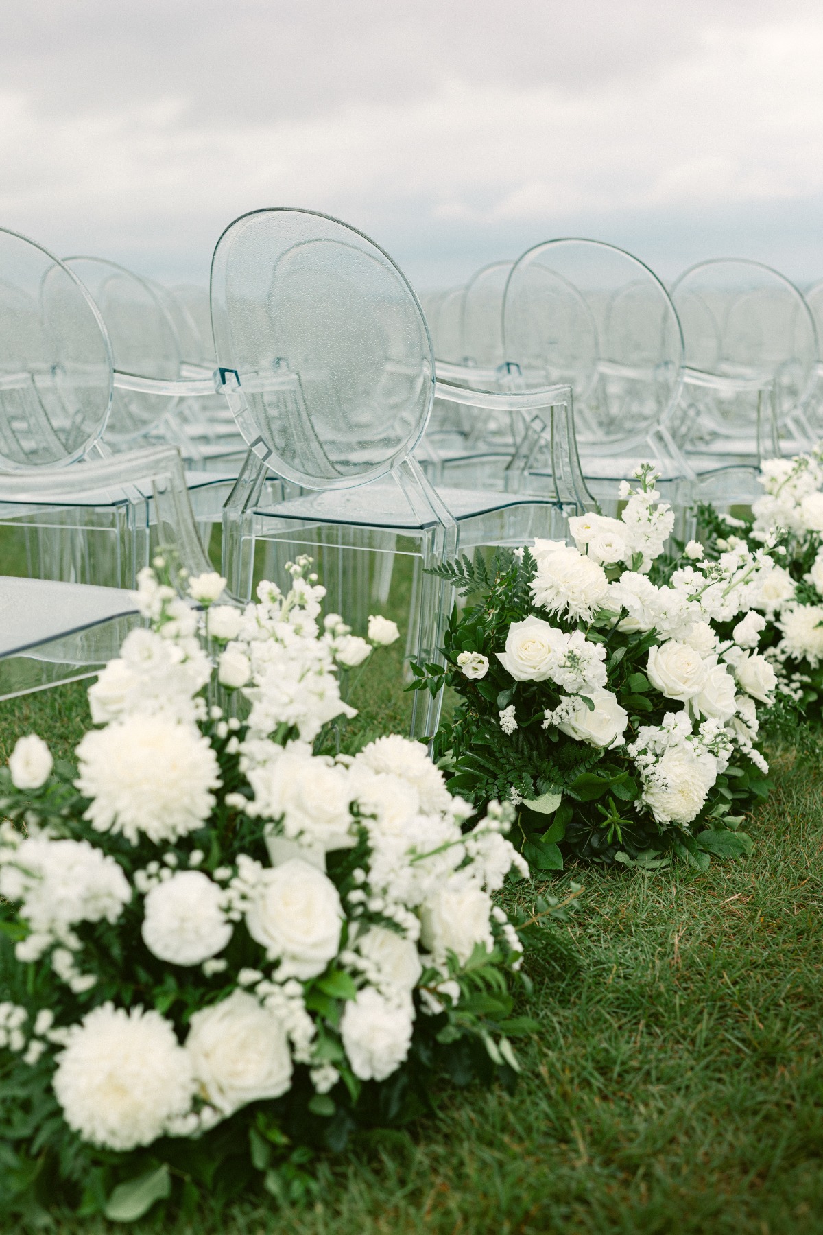 white floral wedding aisle arrangements