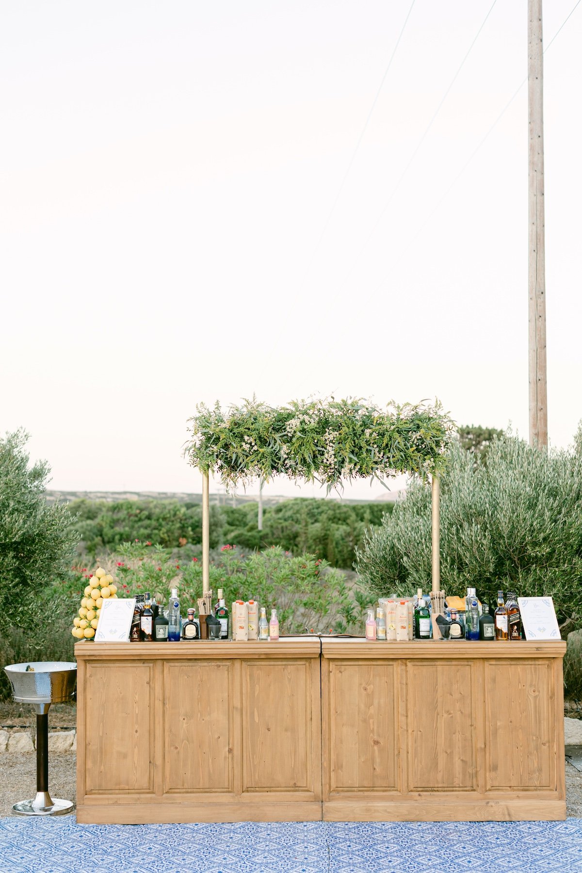 custom wooden outdoor bar at wedding reception