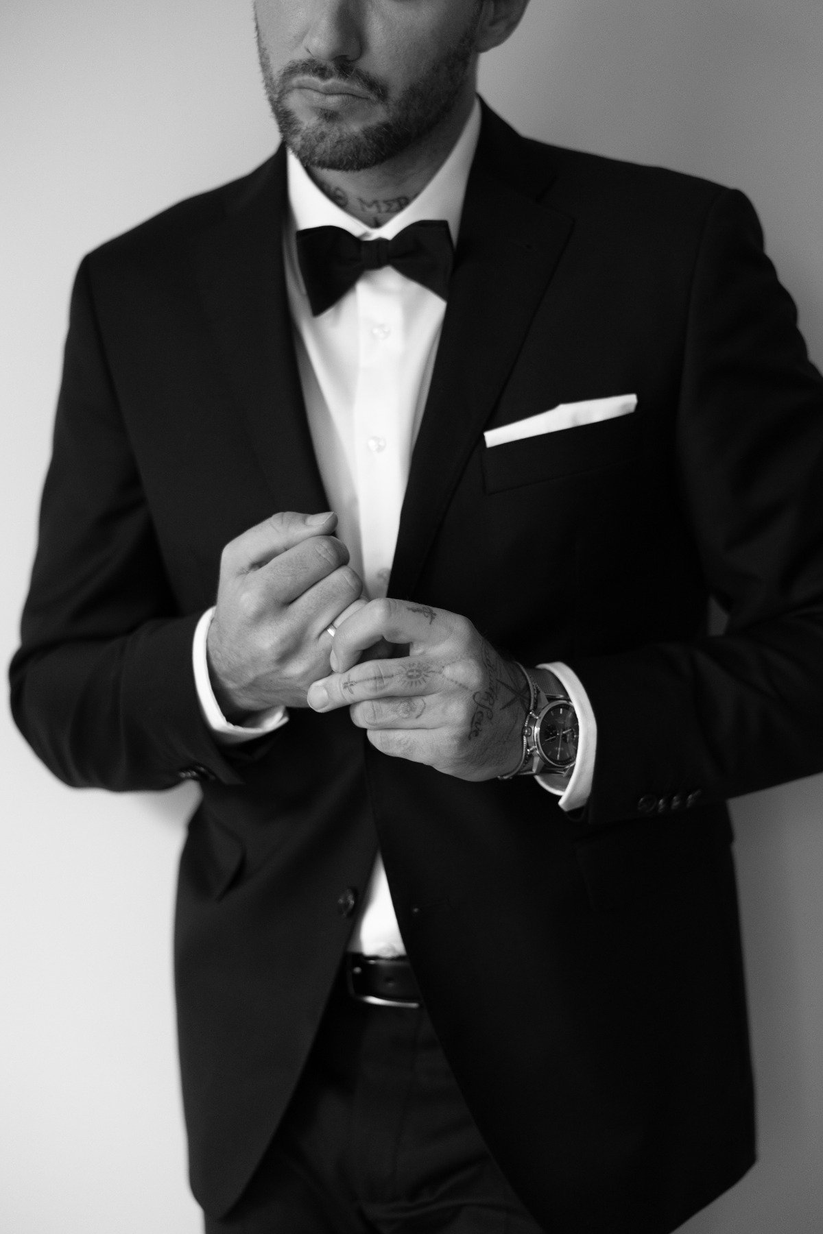 groom in black suit