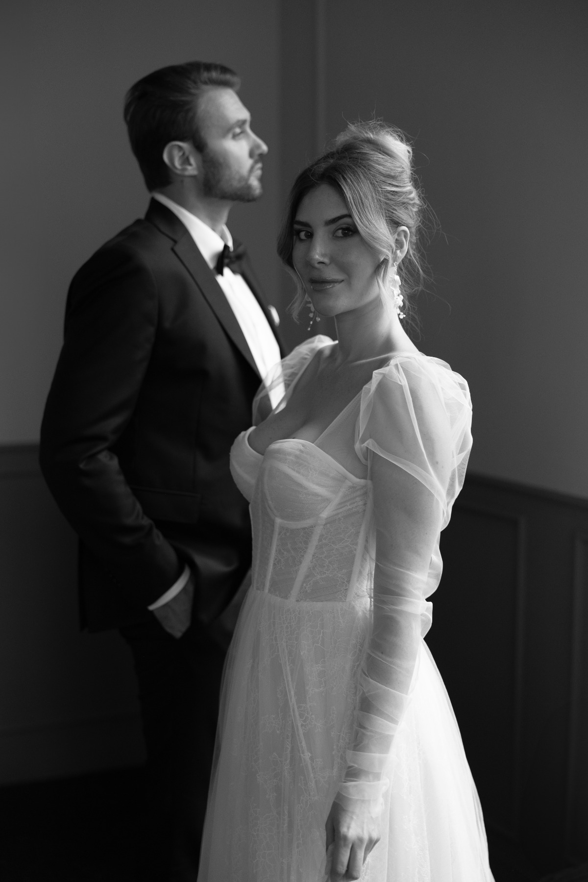 bride in tulle gown with corset and long sleeves