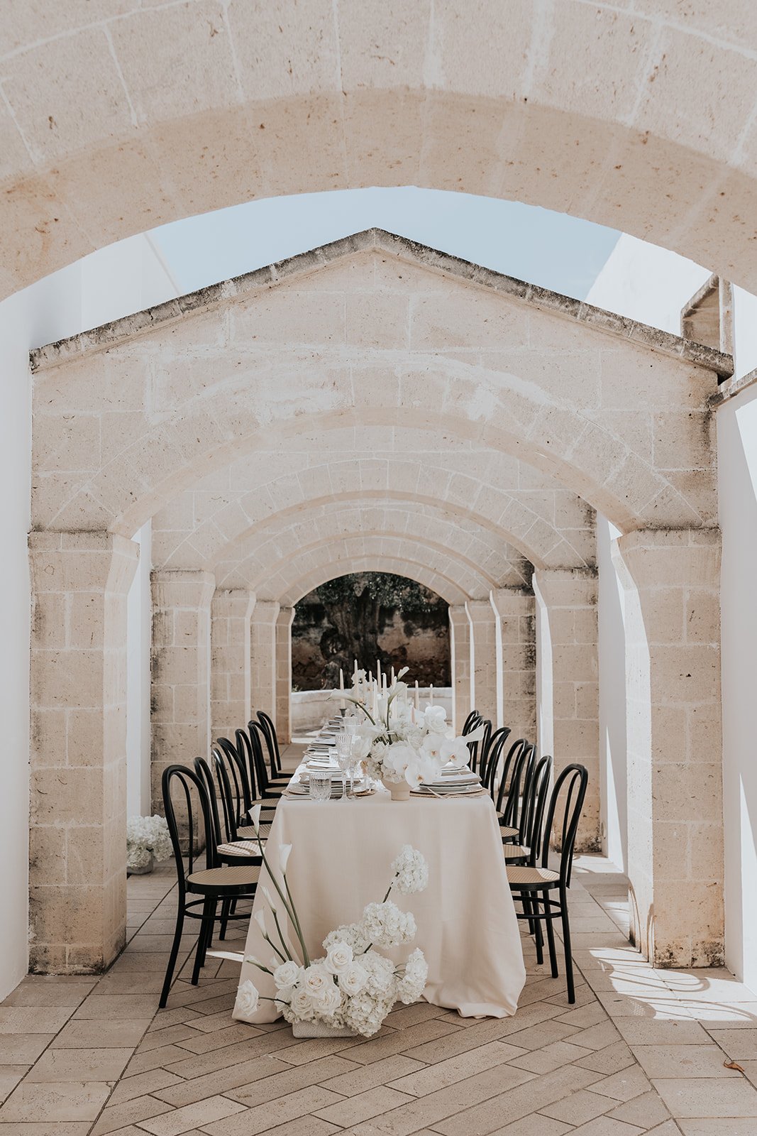 italian stone wedding venue with neutral flowers 