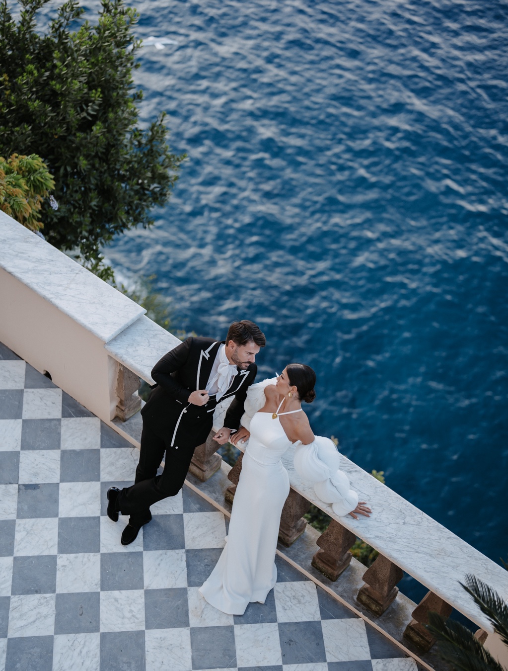 bride and groom on terrace in almafi coast