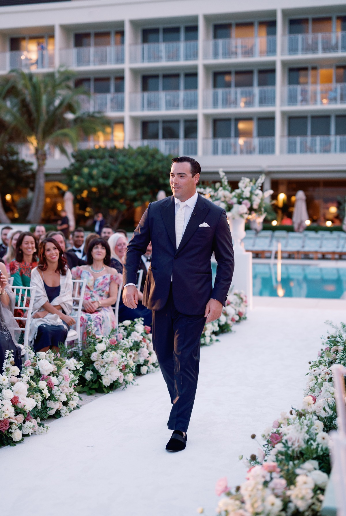 groom walking down the aisle at four seasons palm beach