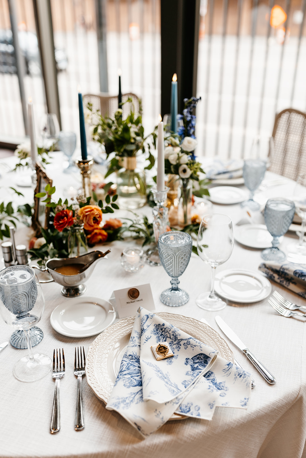 candlelit wedding reception with french cane chairs 