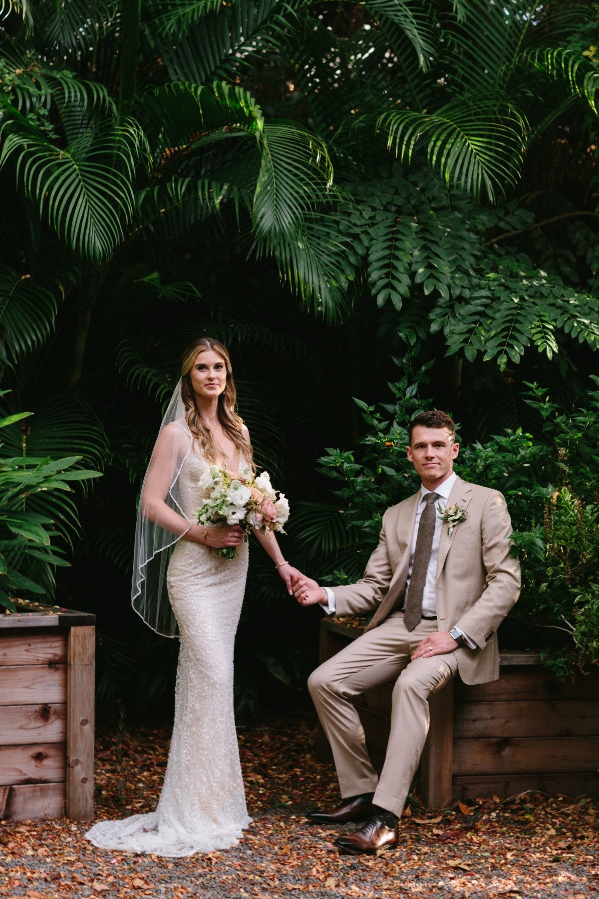 bride in plunging neckline galia lahav wedding dress and groom in tan suit