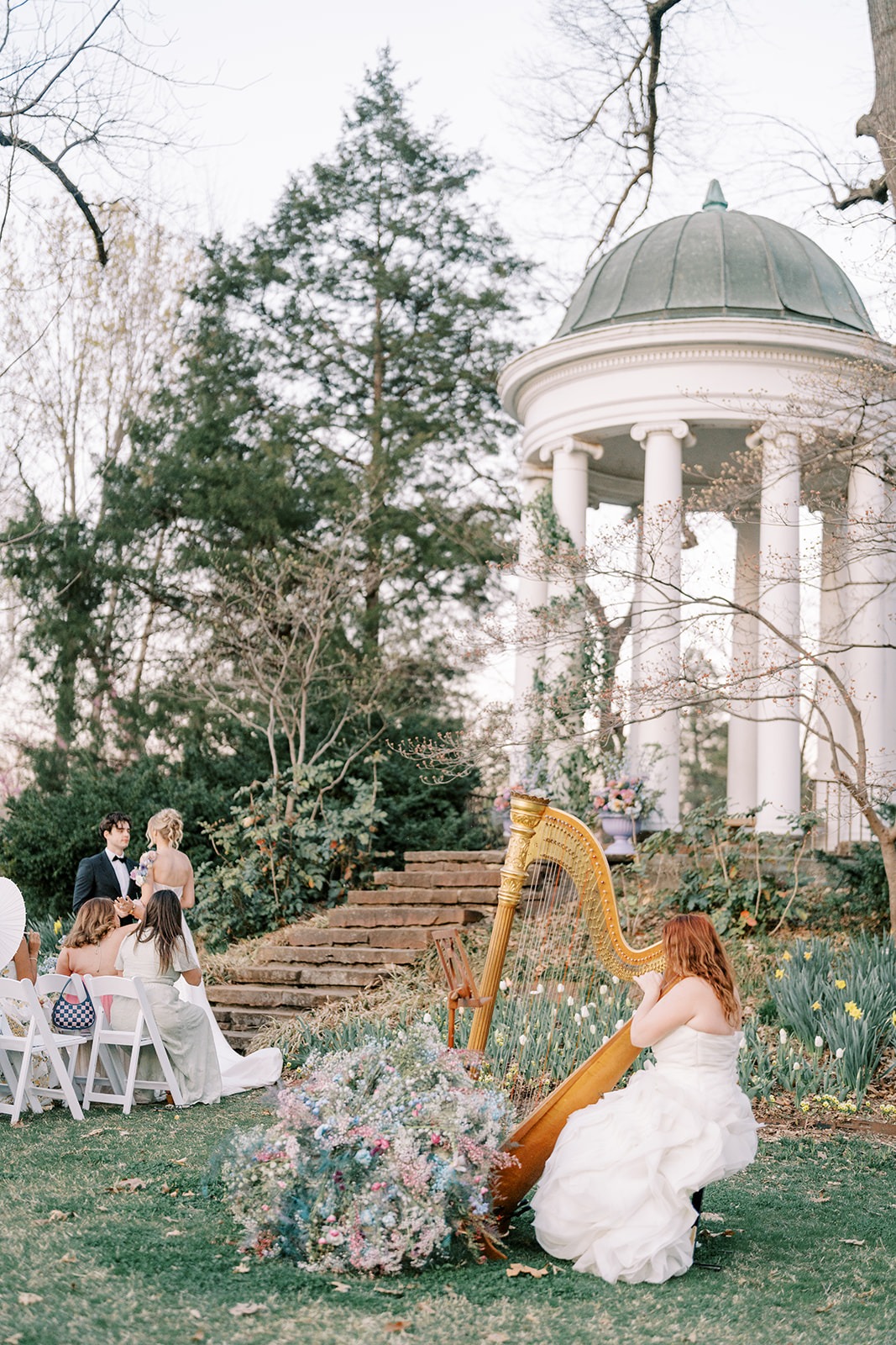 wedding ceremony at rotunda with a live harpist in a gown