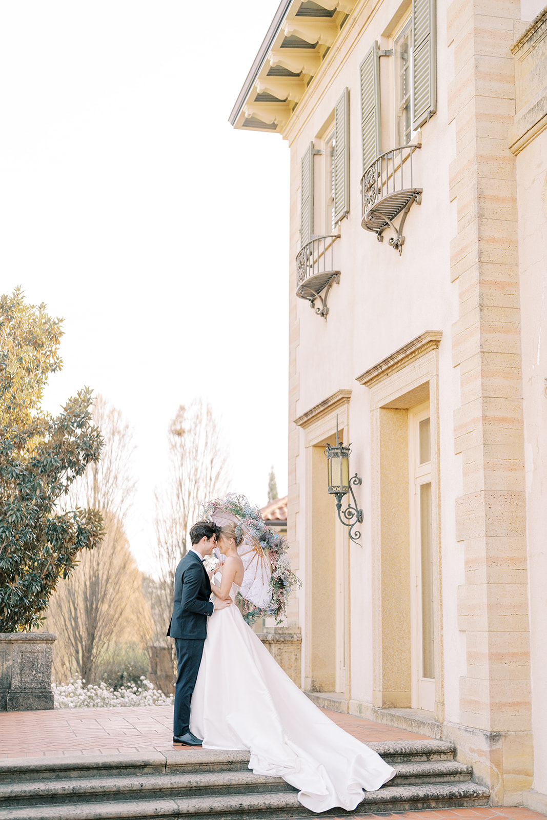 estate museum wedding ideas with floral umbrella