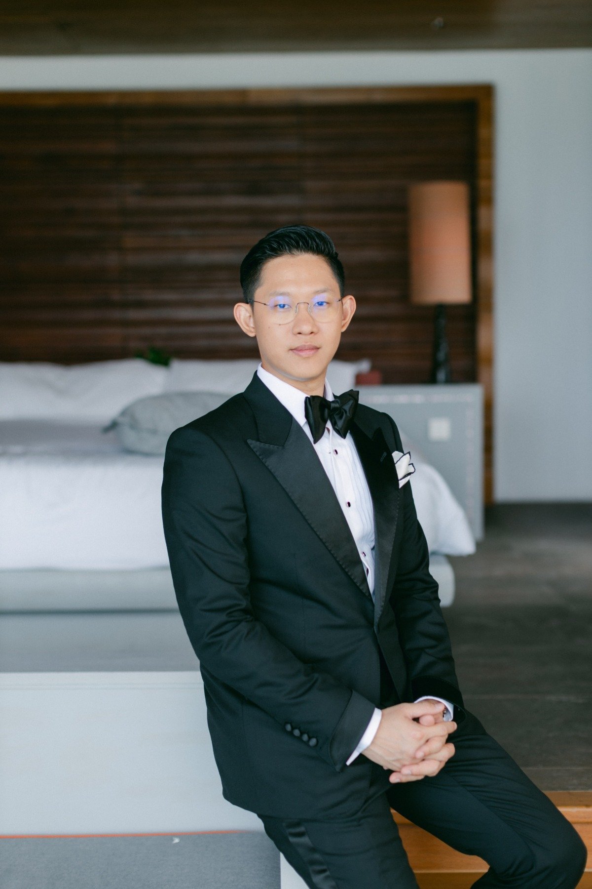 groom in black tuxedo with bowtie