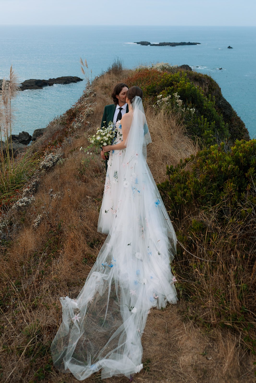 bride and groom at coastal wedding