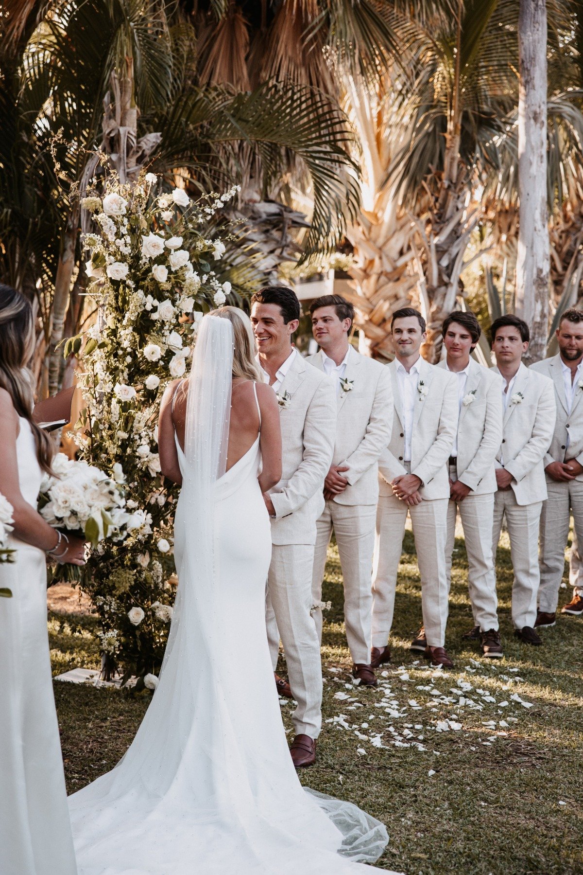 groom and groomsmen in tan linen suits