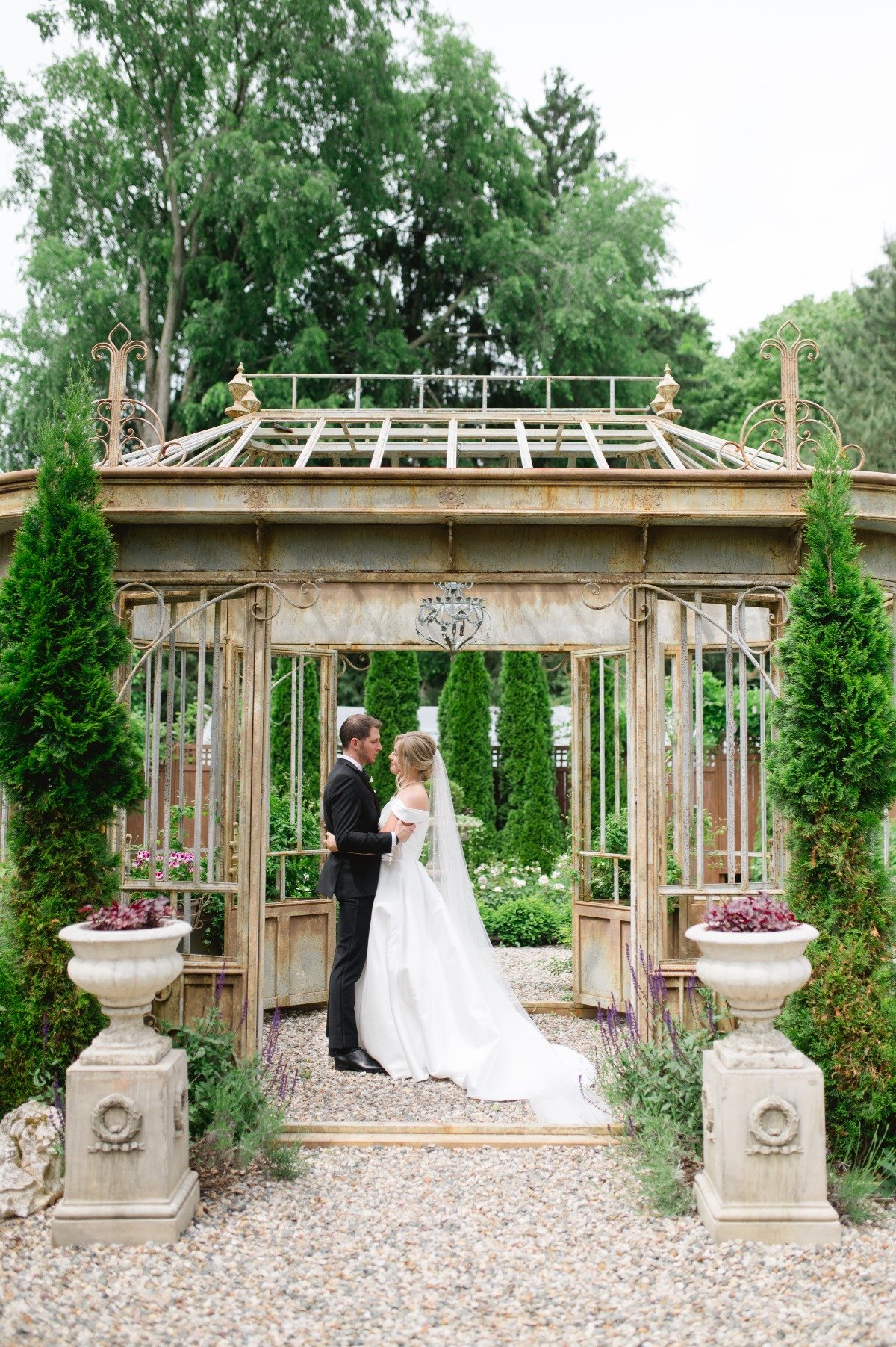 bride and groom in french-inspired garden