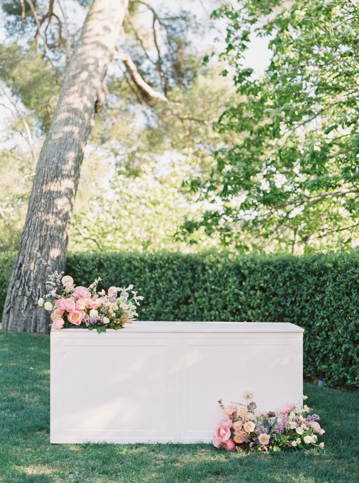 pastel wedding floral arrangements at a portable bar