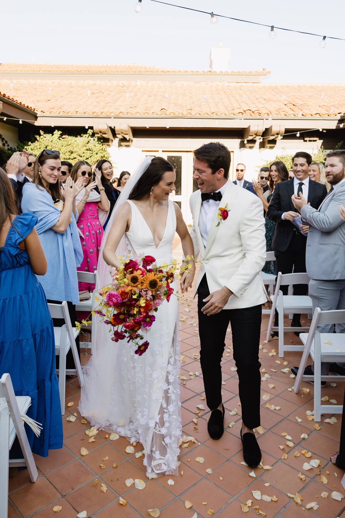 bride and groom walking down the aisle at yacht club wedding ceremony